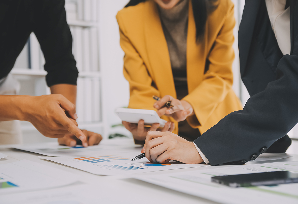 Financial analysts analyze business financial reports on a digit